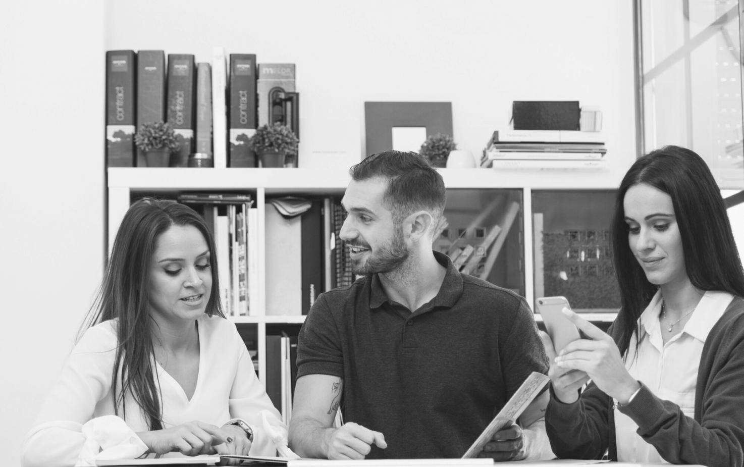 Financial experts reviewing budget documents in collaborative learning environment
